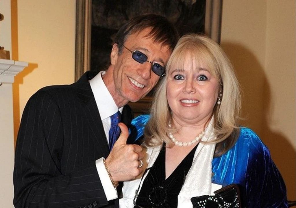 “For the first time in 12 years, Dwina Gibb shares Robin’s unseen tapes, emotional hospital moments, and the private truths behind one of music’s greatest voices.”