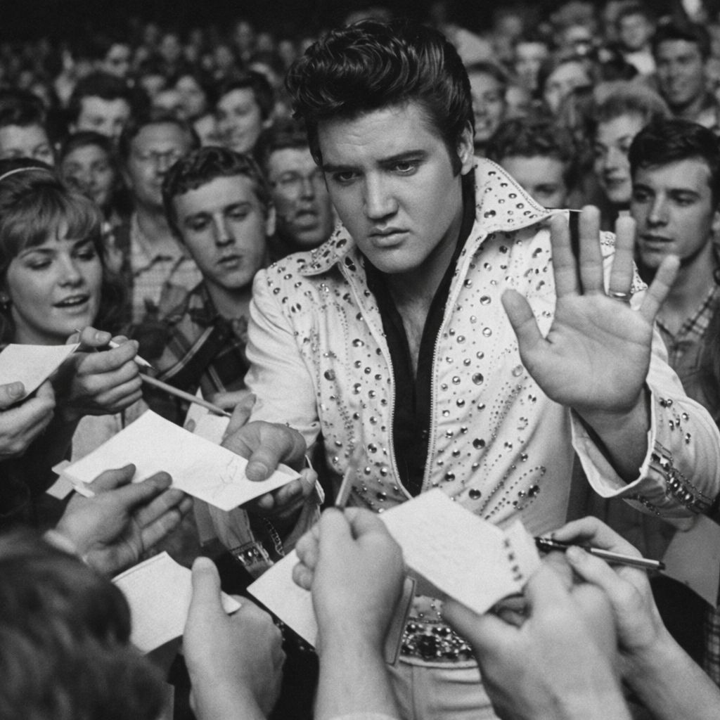 Surprised by the “attitude” of rock and roll music king Elvis Presley in refusing to sign autographs for fans.