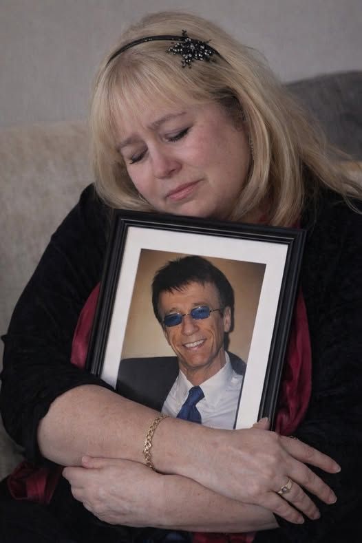 “THEY CALLED IT THE END. SHE CALLED IT FOREVER.” When Robin Gibb took his final bow, Dwina Murphy was left carrying a love the world never fully understood.