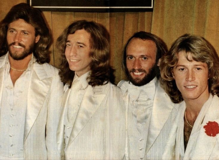Barry, Robin and Maurice Gibb of the Bee Gees, with their brother Andy ...