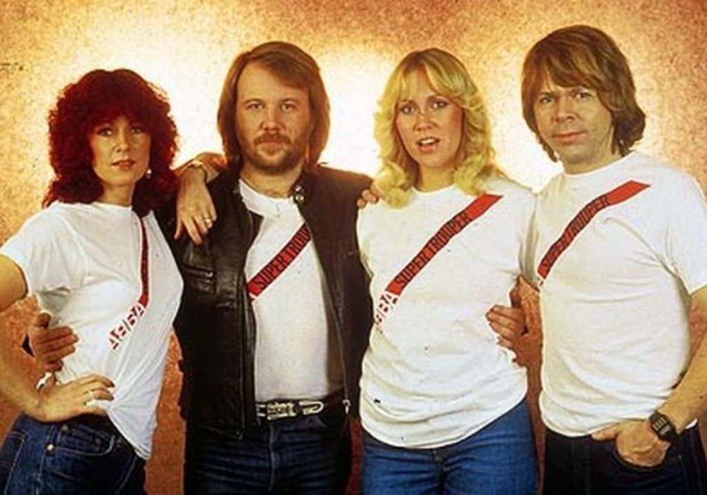 It wasn’t part of the show. No cue, no spotlight shift — just a sudden pause mid-song that felt like the entire arena inhaled at once. When ABBA’s voices softened and the words “we know our time is running out” slipped into the silence, the glitter faded and something more fragile stepped forward. Fans who had grown up with their bright harmonies didn’t scream; they listened, as if every lyric suddenly carried the weight of decades lived alongside the music. In that unplanned stillness, the performance stopped feeling like spectacle and started feeling like truth — a reminder that every reunion is borrowed time, every chorus a fleeting gift. For a moment, it wasn’t nostalgia onstage. It was four artists letting the world see the human heartbeat behind the legend.”
