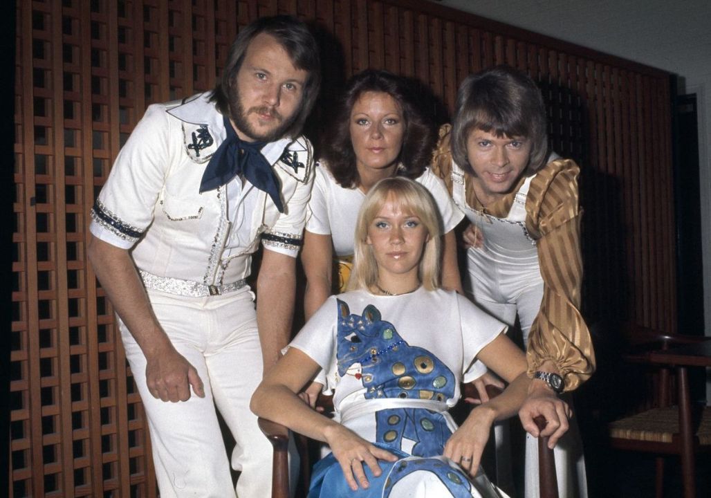 “More than 40,000 fans were on their feet last night — not because of the lights or the music, but because of one deeply moving act of kindness from Agnetha Fältskog. In the middle of her sold-out concert, Agnetha suddenly stopped singing. The band fell quiet. Without saying a word, she stepped down from the stage and made her way to the front row, where she gently reached for the hand of an elderly woman sitting by herself. The audience watched in silence as Agnetha guided her into the spotlight. What most of them did not realize was that this woman had been a devoted fan for more than twenty years — quietly showing up to nearly every performance within driving distance, never once asking to be noticed. Agnetha then knelt beside her, leaned in to whisper something only the two of them could hear, and wrapped her in a tender embrace so moving that it brought the woman to tears — and left the entire arena standing in applause.”